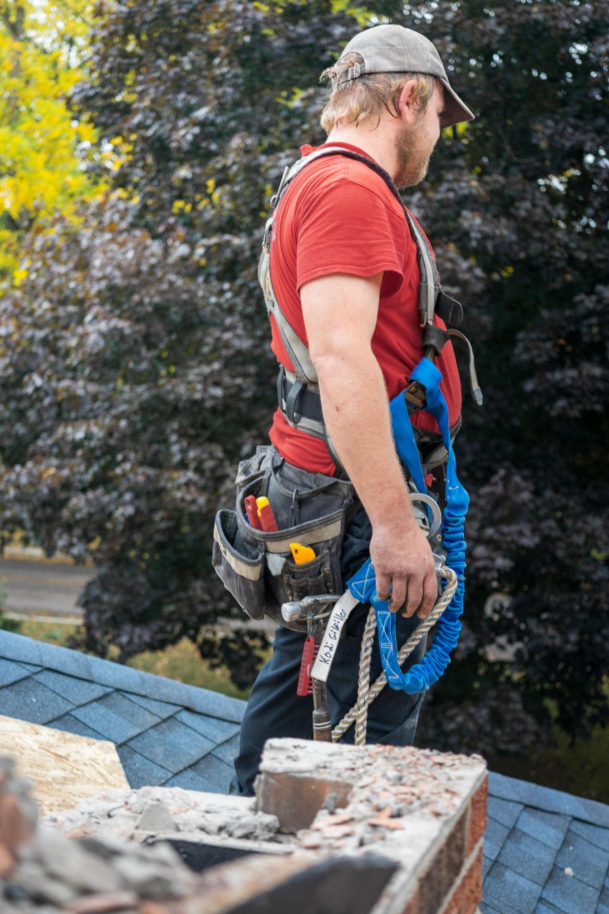 Professional roofing specialist carrying out a residential roof inspection