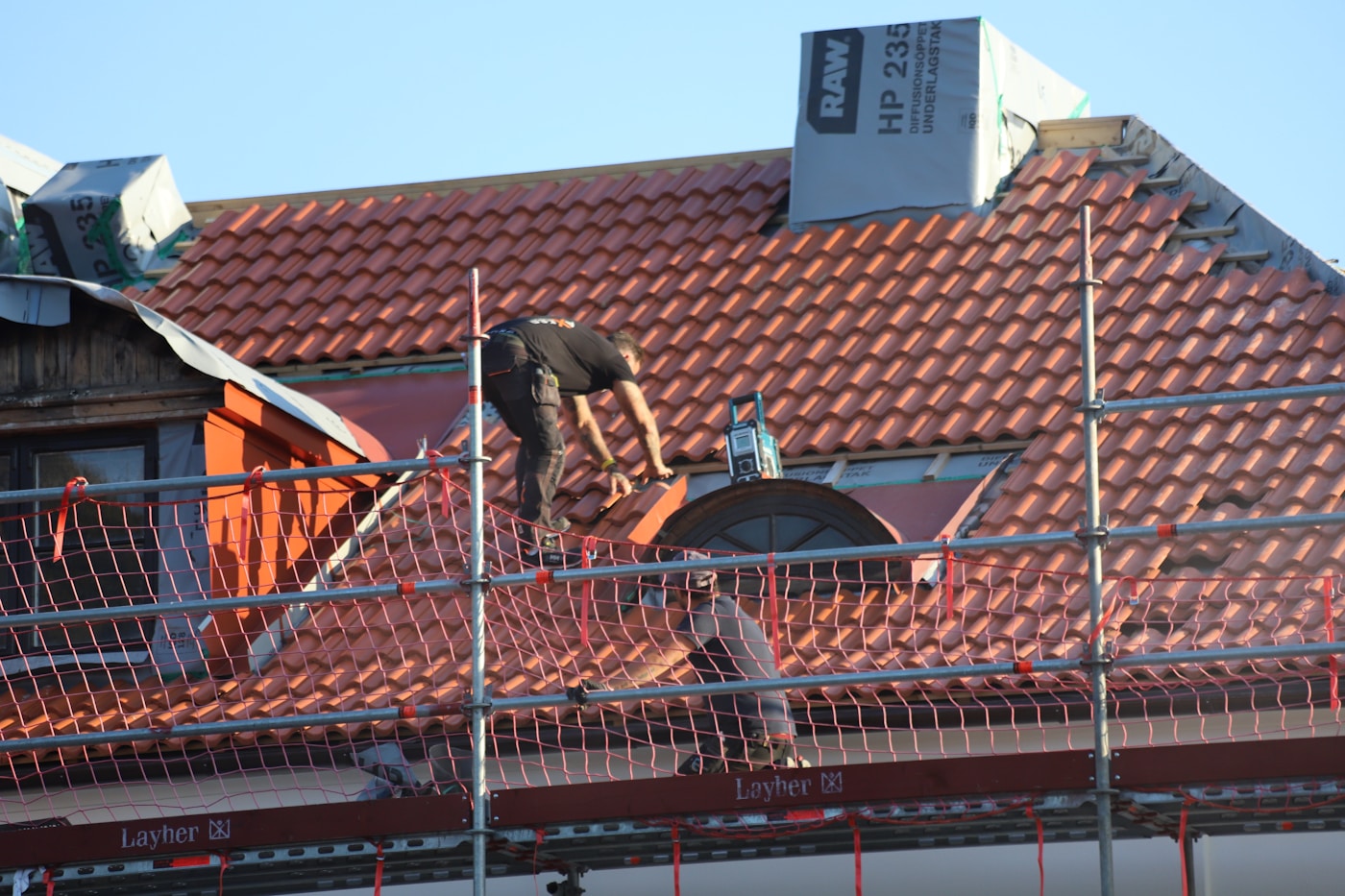 Roofers installing a residential roof